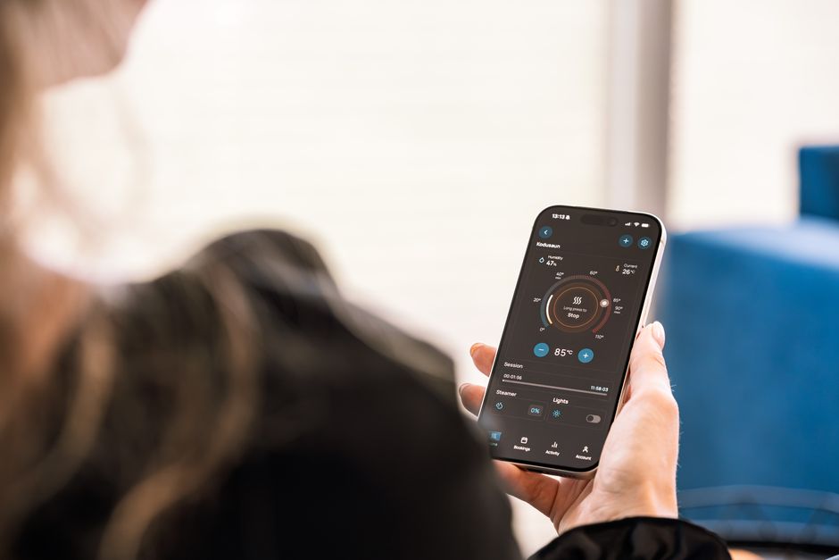 Person using a smart home energy app to track solar generation